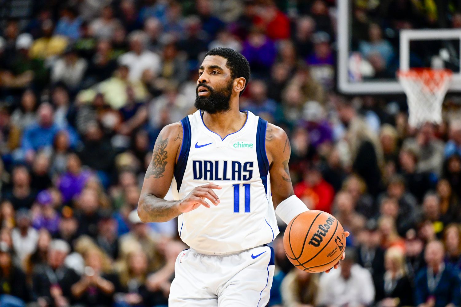 Dallas Mavericks guard Kyrie Irving dribbles the ball against the Utah Jazz.